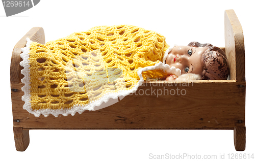 Image of Dolls in bed