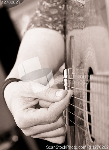 Image of playing guitar