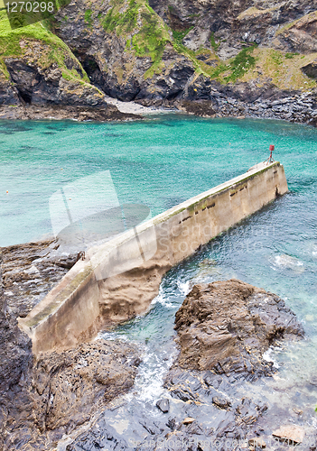 Image of Vibrant detailed image of an old stone pier in Port Isaac, Cornw