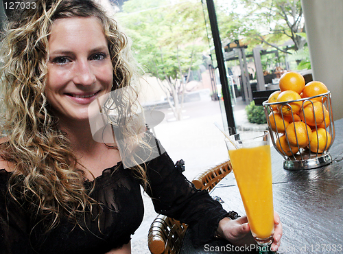 Image of Sexy woman having a juice