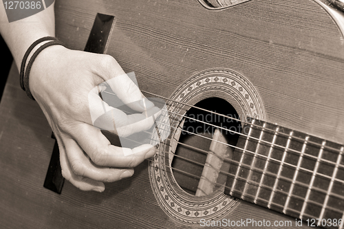 Image of playing guitar