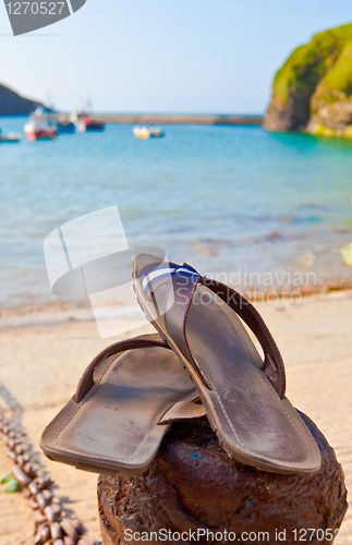 Image of Summer concept, sandals by the beach