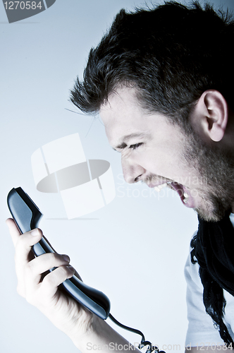 Image of Man shouting on the phone