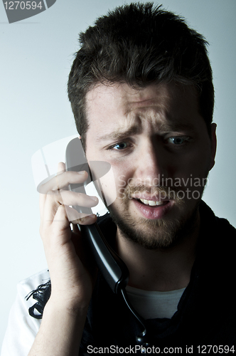 Image of Young man on the phone