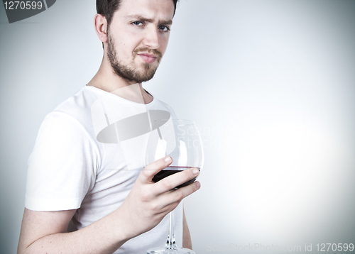 Image of Young Man Posing with Wine