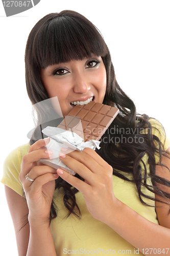 Image of Beautiful girl eating a block of chocolate