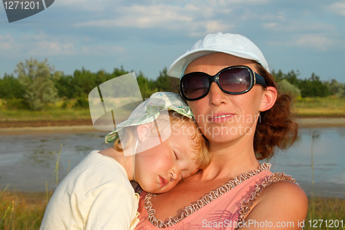 Image of Mother and small slipping daughter