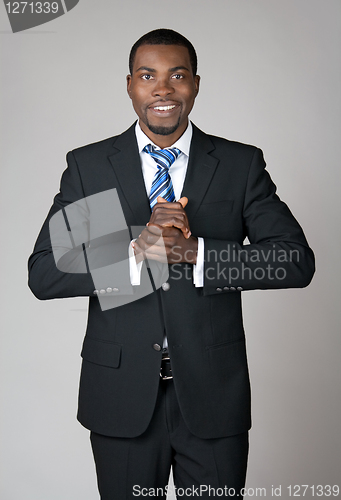 Image of Smiling welcoming businessman