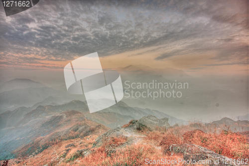 Image of mountain sunset and colored sky with clouds 