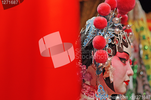 Image of chinese opera dummy and red cloth as text space ,it is a toy,not