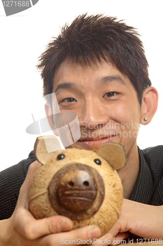 Image of asia man with piggy bank 