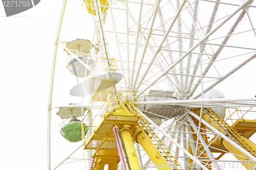 Image of ferris wheel against a blue sky