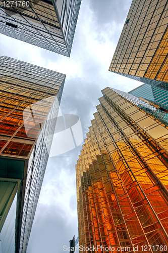 Image of Skyscrapers with clouds reflection 