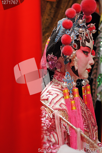 Image of chinese opera dummy and red cloth as text space ,it is a toy,not