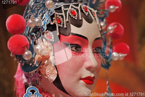 Image of chinese opera dummy and red cloth as text space ,it is a toy,not