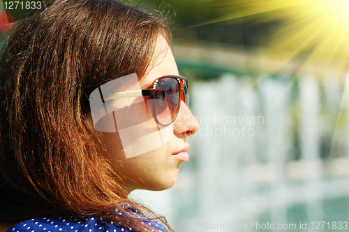 Image of young girl in sun glasses
