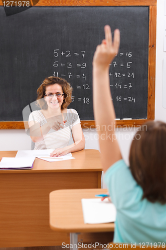 Image of School girl raising arm