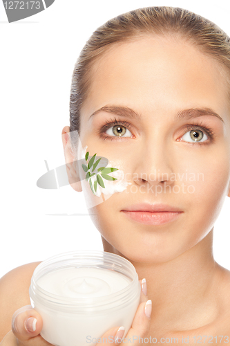 Image of Beautiful women applying moisturizer cosmetic cream