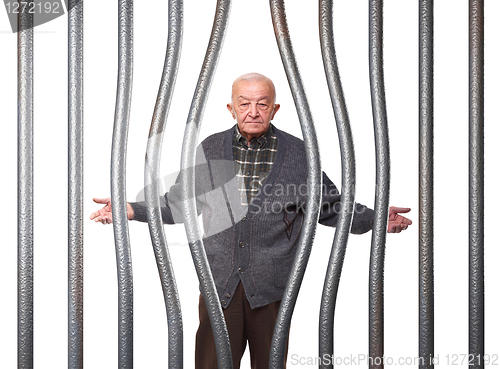 Image of old man in prison