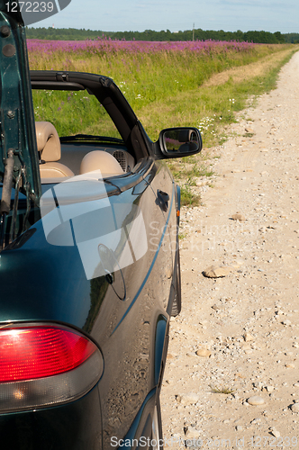 Image of Green cabrio on the road