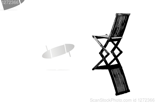 Image of Old chair in calm water