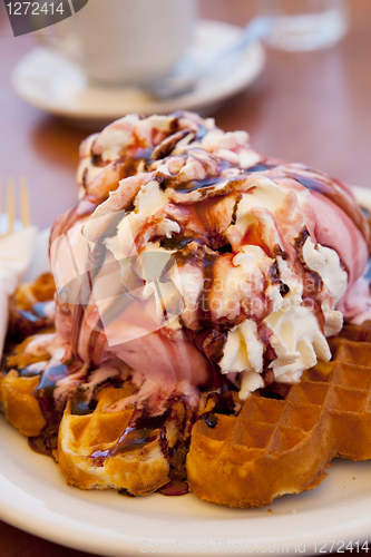 Image of Waffles with ice cream and whipped cream