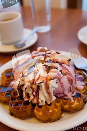 Image of Waffles with ice cream and whipped cream