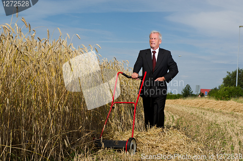 Image of Businessman and his Lawn mower