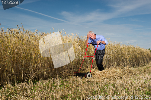 Image of Businessman and his Lawn mower