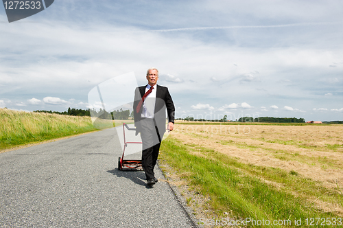 Image of Businessman and his Lawn mower