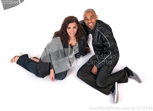 Image of Happy man and woman sitting close to each other