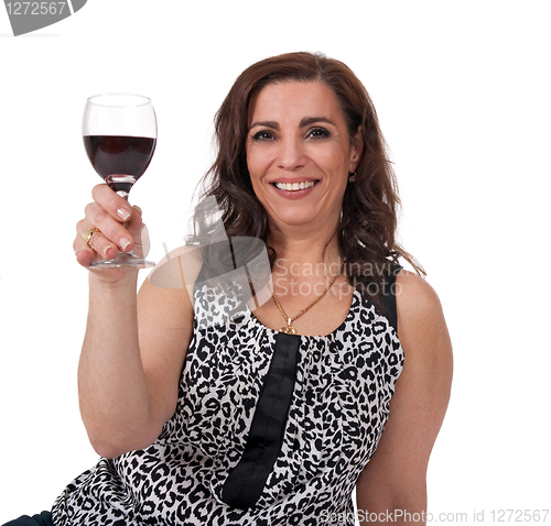 Image of Smiling mature woman with a glass of wine