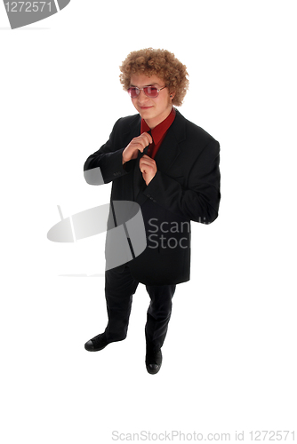 Image of Businessman doing up his tie