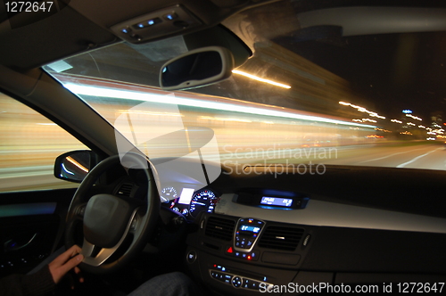 Image of car in motion at night