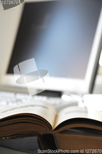 Image of books and computer