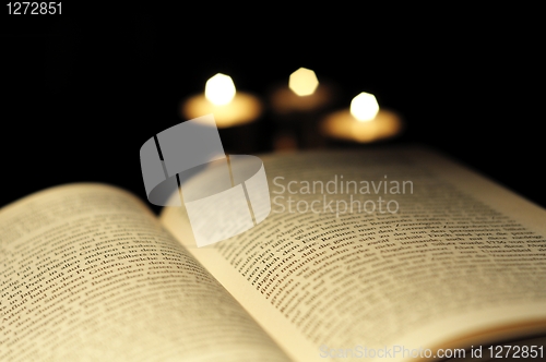 Image of book and candle