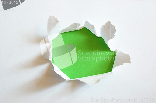Image of green hole in blank sheet paper