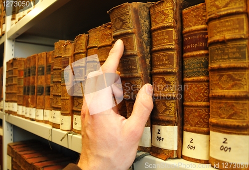 Image of old books in a library