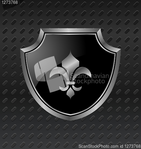 Image of heraldic shield on metallic background