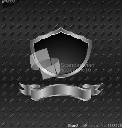 Image of heraldic shield on metallic background