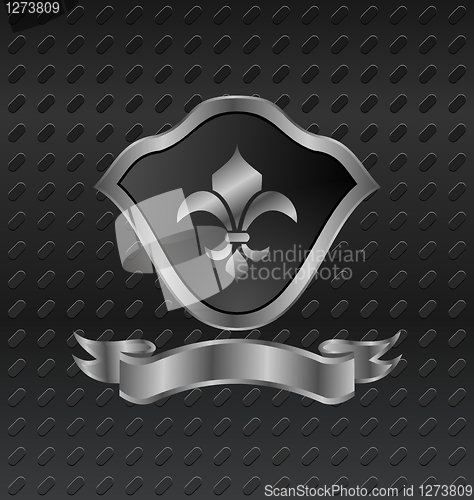 Image of heraldic shield on metallic background