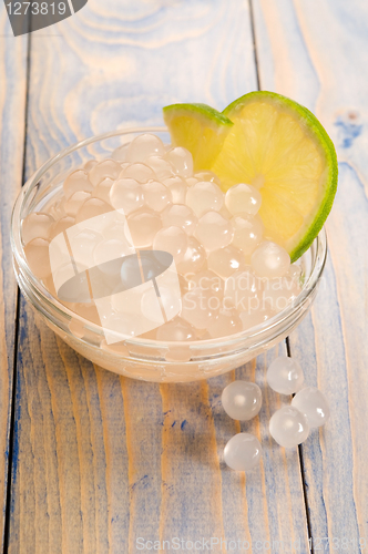 Image of tapioca pearls with lime. white bubble tea ingredients