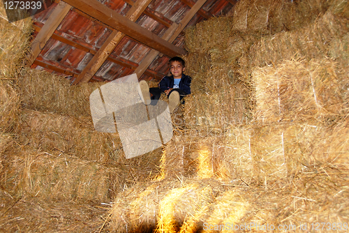 Image of Boy on straw bales