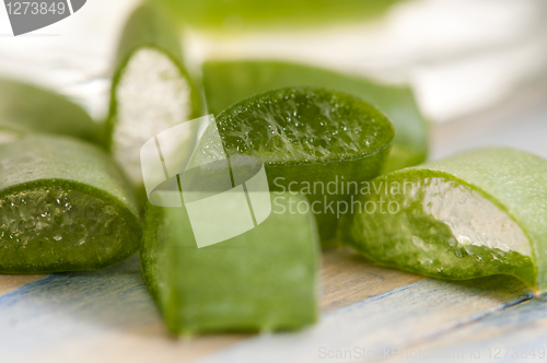 Image of aloe vera juice with fresh leaves