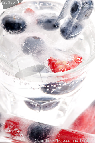 Image of Raspberry and blackberry frozen in ice sticks