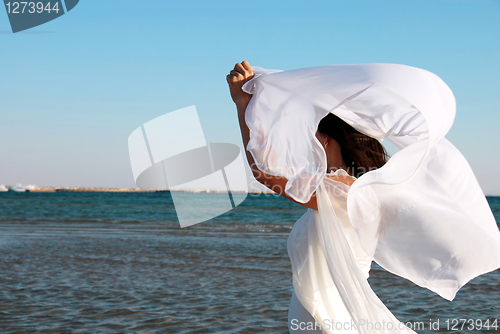 Image of Woman in white at seaside