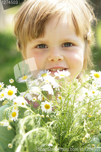 Image of Little girl with daisies