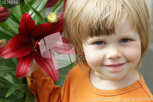 Image of Little girl with a lily