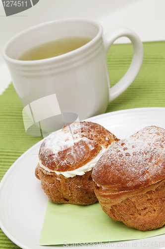 Image of Two profiteroles and tea