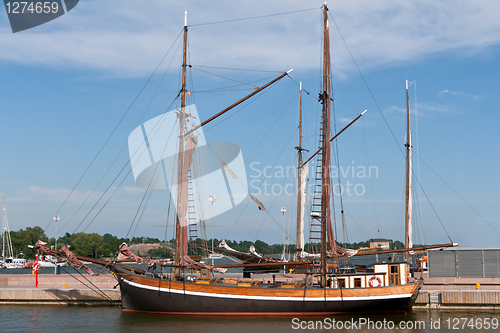 Image of wooden sailing vessel in the port